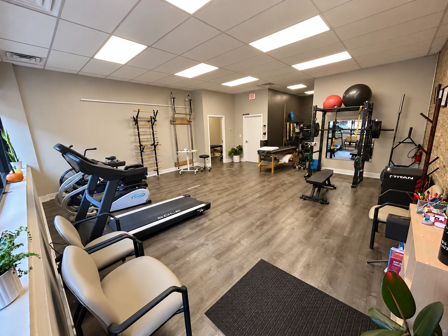MILO clinic with treatment tables, strength equipment, and an open exercise area