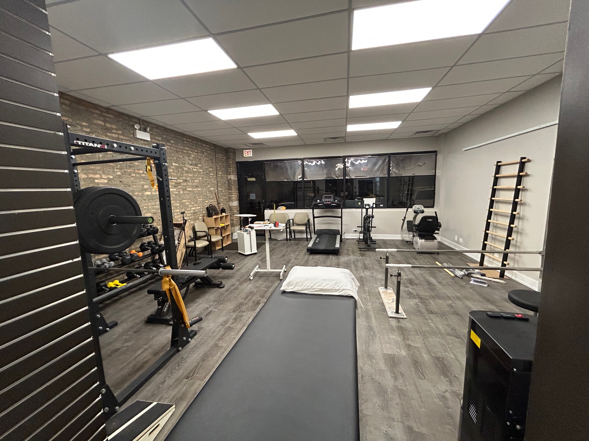 Treatment area with strength rack and equipment